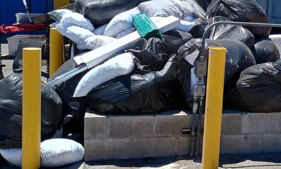 Bagged construction debris staged for haul-off