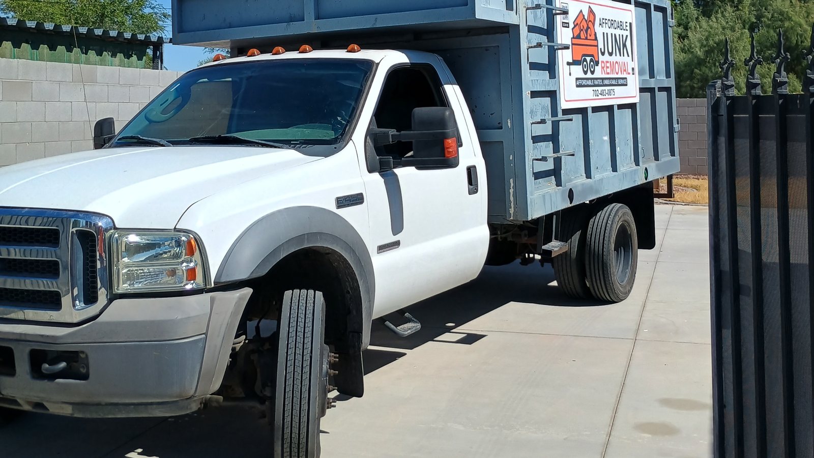 Affordable Junk Removal LLC truck loaded with hauled-away furniture and debris